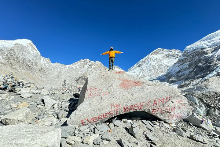 Mountaineer Posing on a Rock at the Everest Base Camp